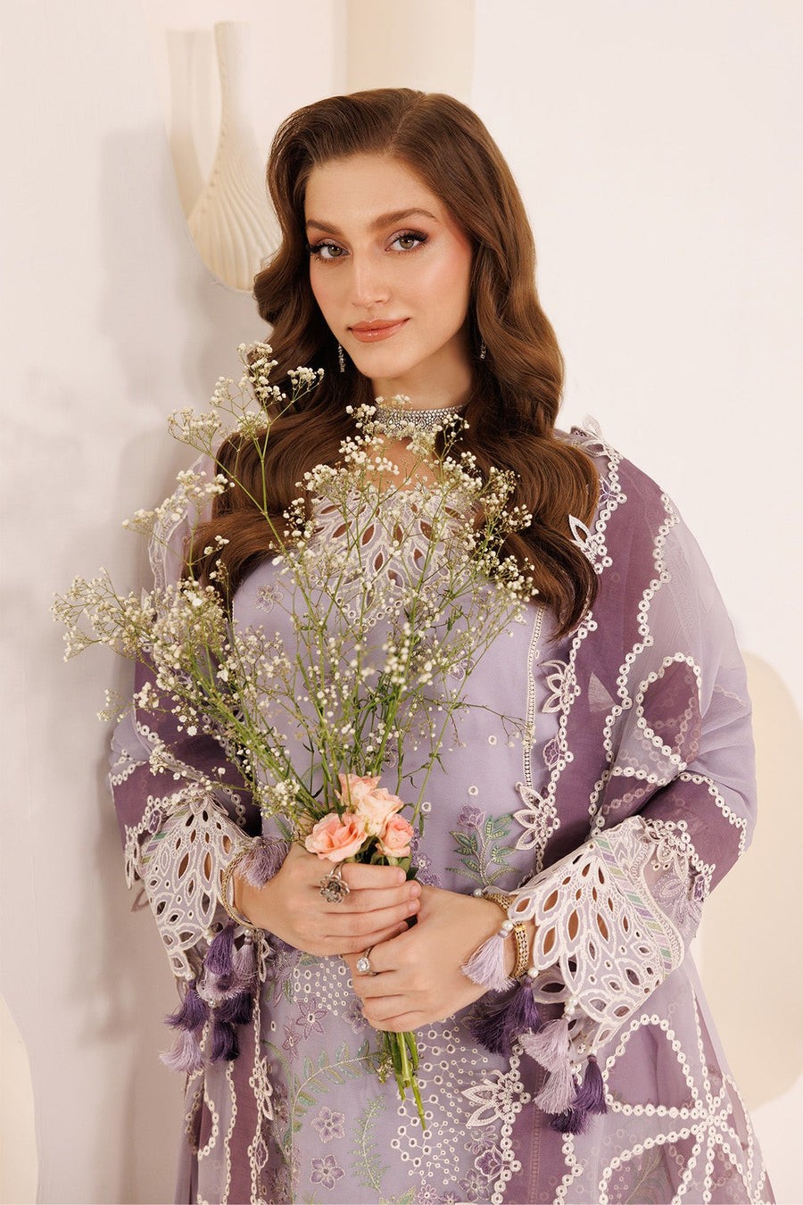 Full view of woman dressed in light purple chiffon embroidered suit with matching embroidered dupatta