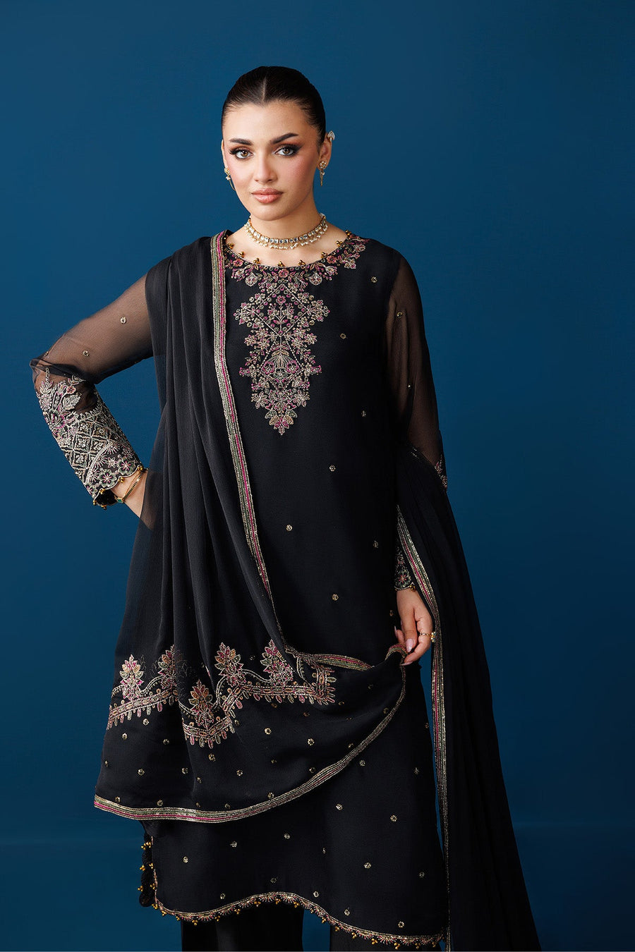 Close-up side view showing intricate embroidery on sleeve cuffs and back detail