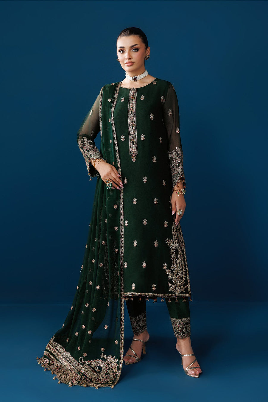 Front view of emerald green traditional suit with floral embroidery and chiffon sleeves