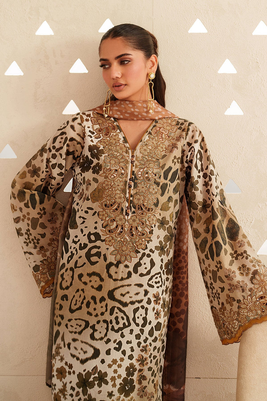 Close-up of neckline embroidery and animal print pattern on the lawn fabric
