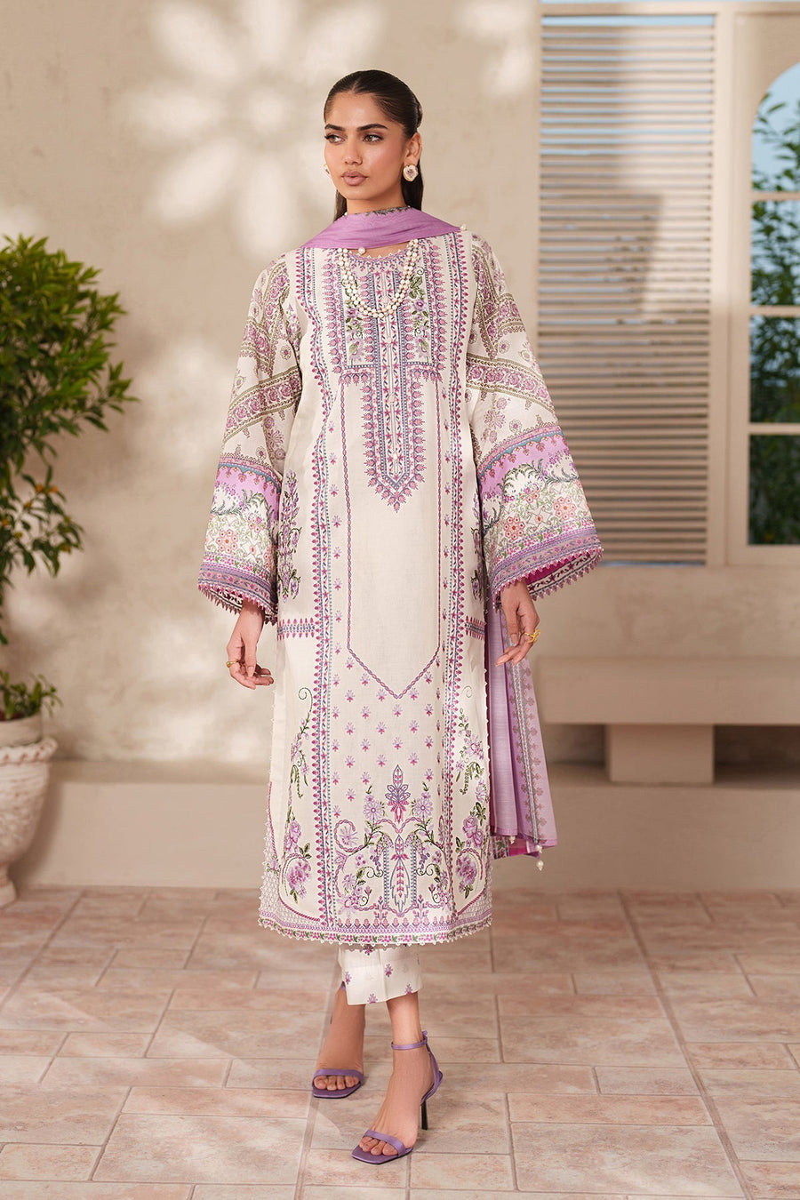 Elegant full length front view of embroidered floral lawn suit with detailed motifs, organza sleeves, and coordinating pastel chiffon dupatta.