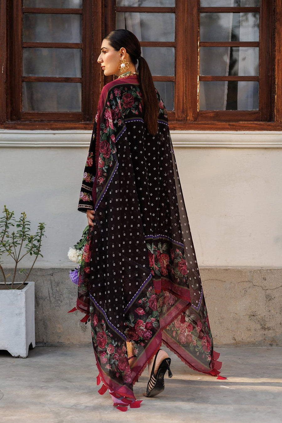 Back view showcasing printed chiffon dupatta with floral and geometric patterns draped over the embroidered lawn suit