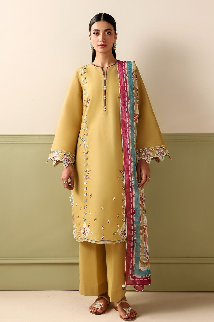 Mustard Embroidered Lawn Suit with Dyed Cambric Trousers and Stripes Woven Dupatta Description: