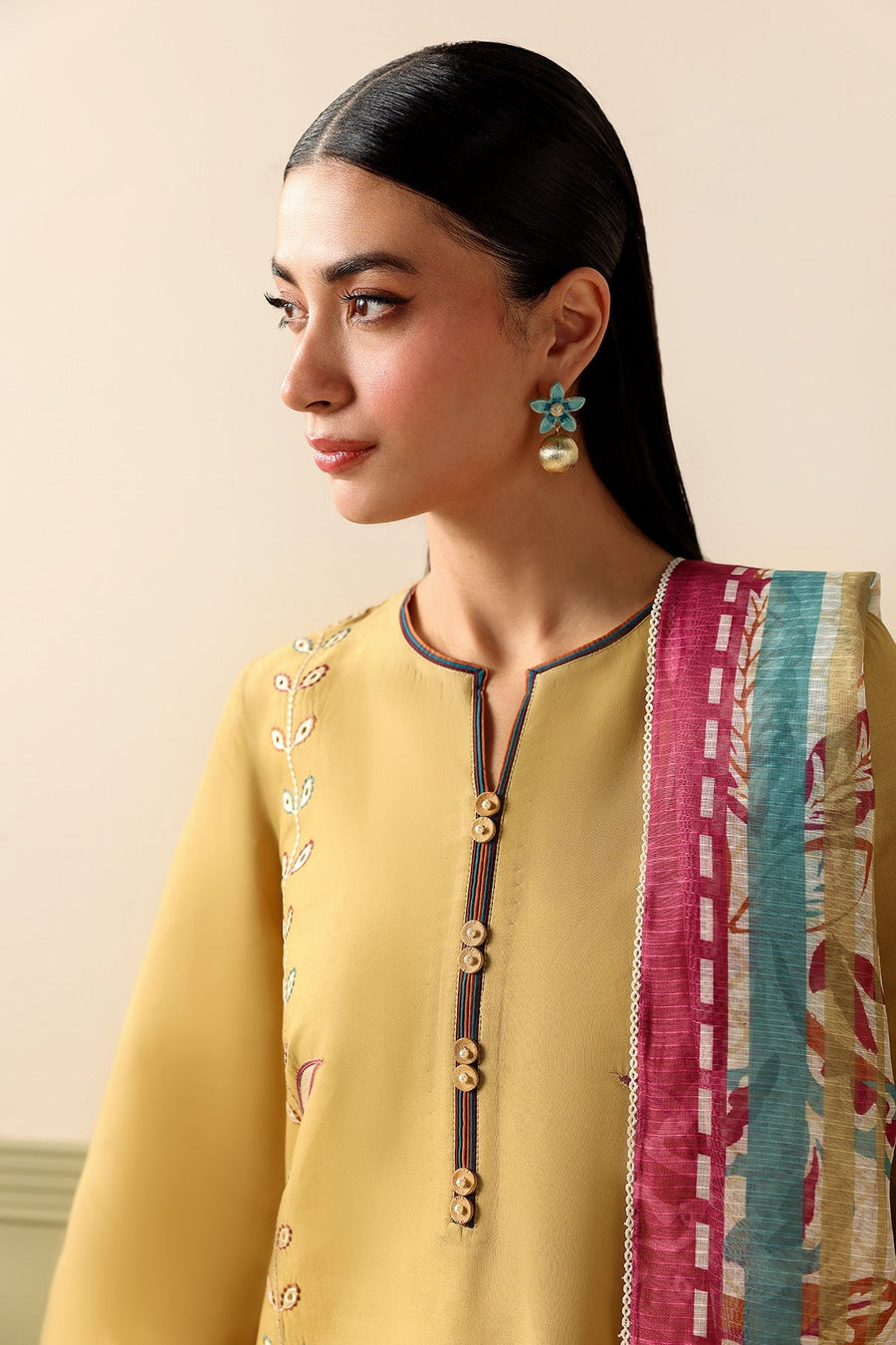 Mustard Embroidered Lawn Suit with Dyed Cambric Trousers and Stripes Woven Dupatta Description: