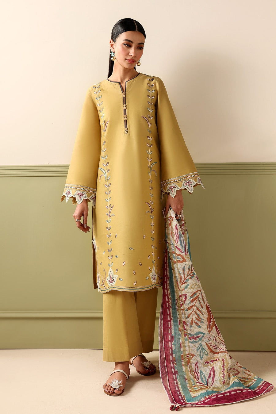 Mustard Embroidered Lawn Suit with Dyed Cambric Trousers and Stripes Woven Dupatta Description: