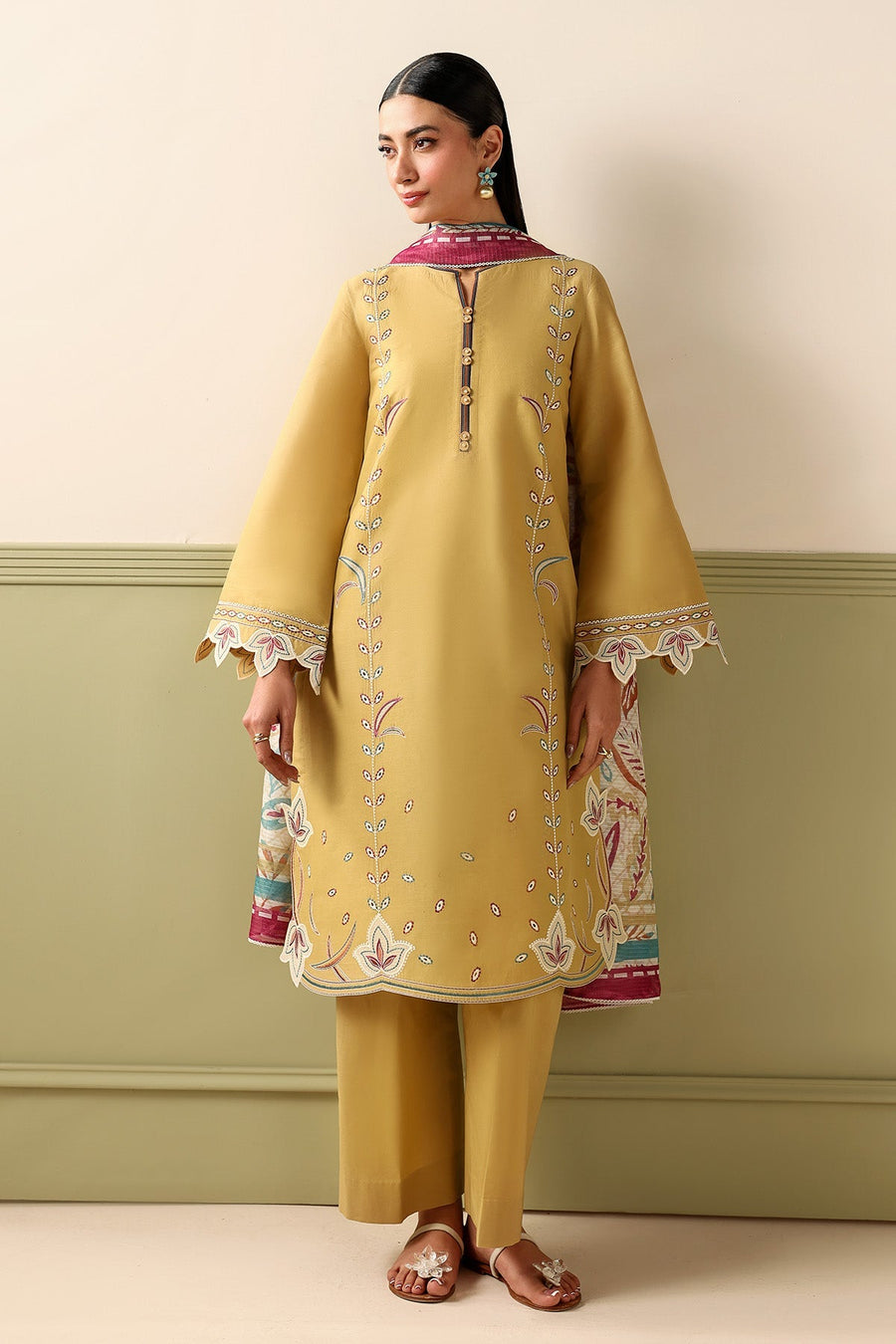 Mustard Embroidered Lawn Suit with Dyed Cambric Trousers and Stripes Woven Dupatta Description: