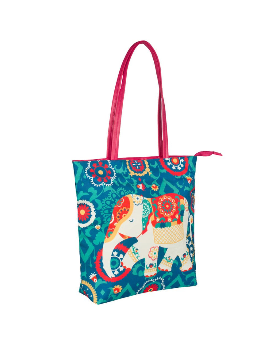 Angled side view of the colorful elephant printed tote bag showing pink handles and full pattern detail
