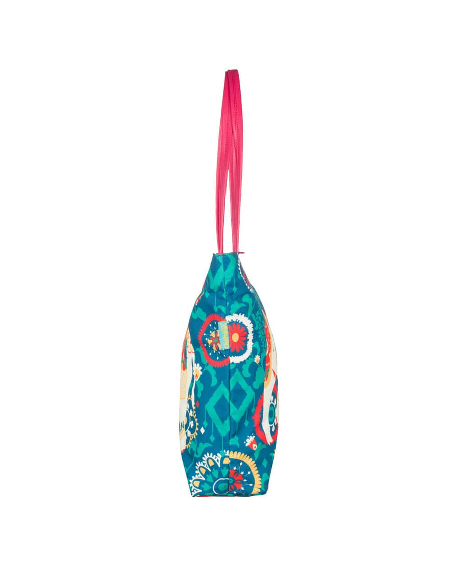 Side profile of the tote bag highlighting its slim design and continuation of the floral elephant pattern