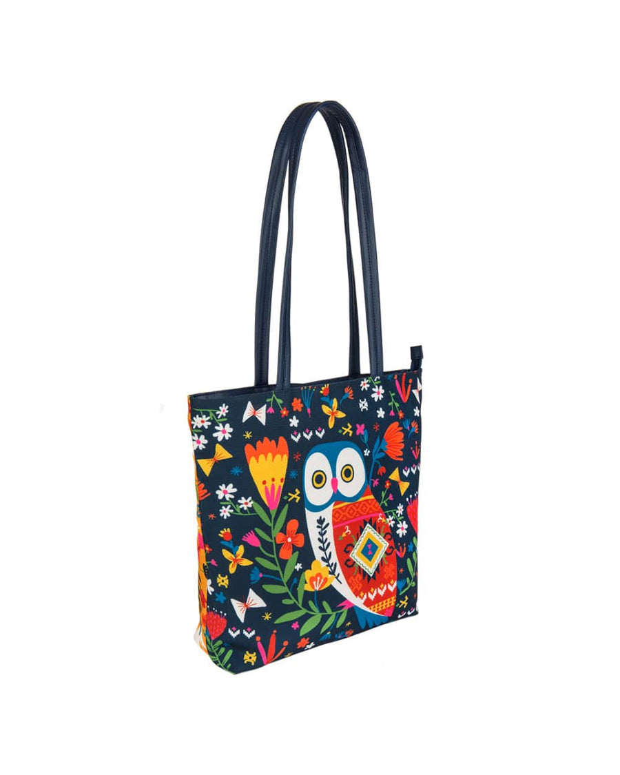 Angled side view of owl print tote bag showing navy blue front and multicolor side panel