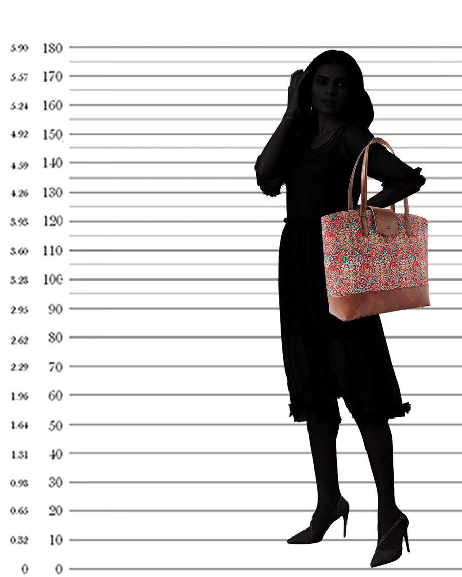 Silhouette of a woman carrying the floral tote bag over her shoulder against a height chart background
