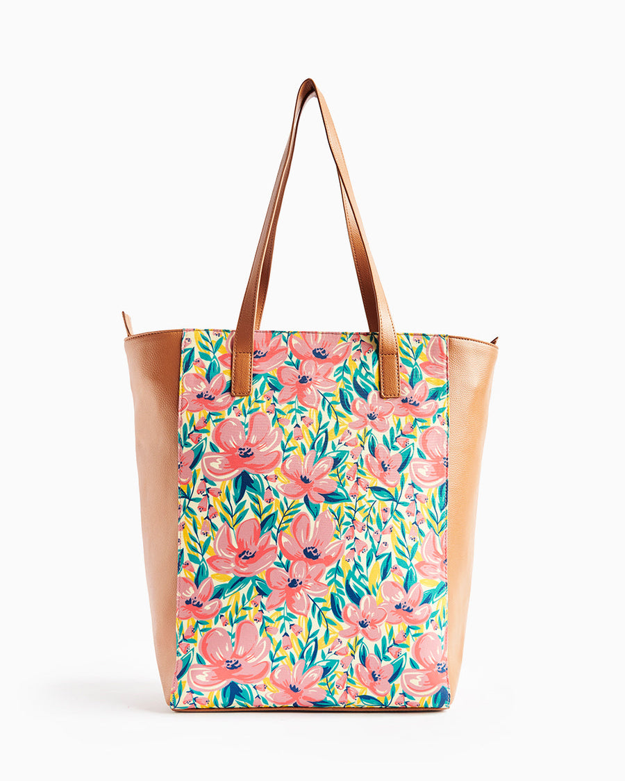 Back view of floral tote bag showing the floral pattern and tan faux leather sides and handles