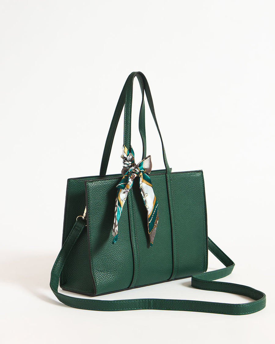 Green structured mini tote bag displayed with detachable adjustable shoulder strap and printed scarf