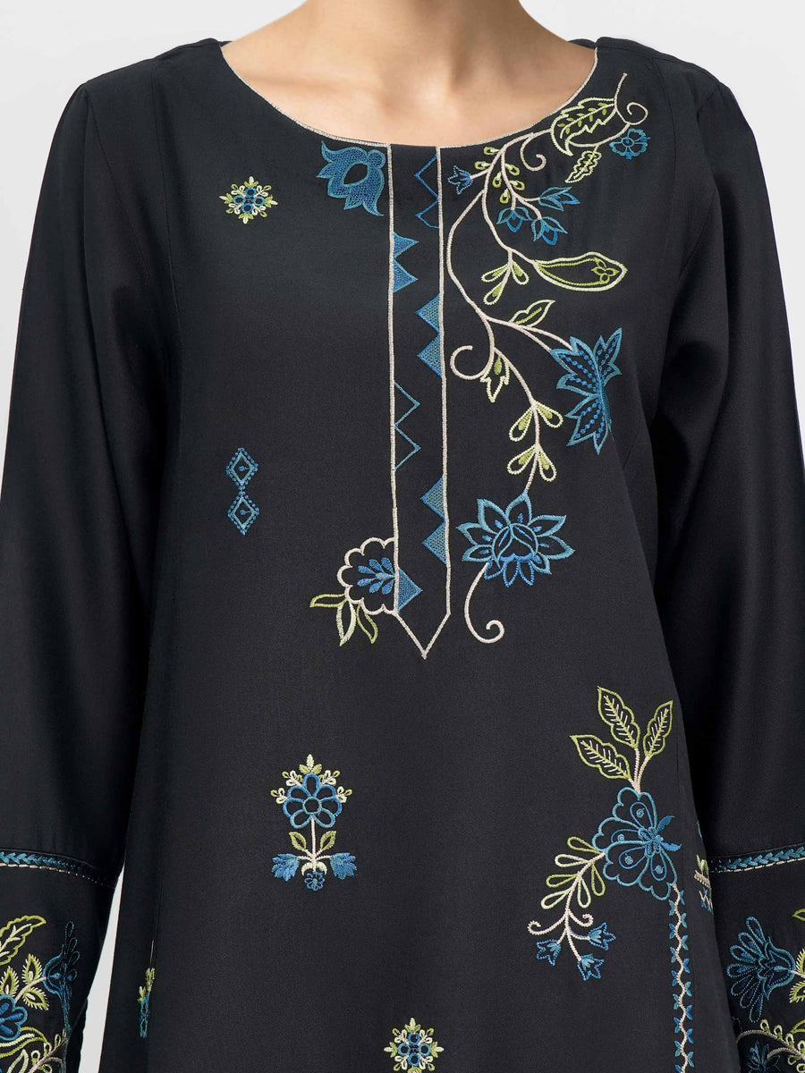 Close-up of embroidered blue and green floral pattern on black crepe kurti neckline and chest area