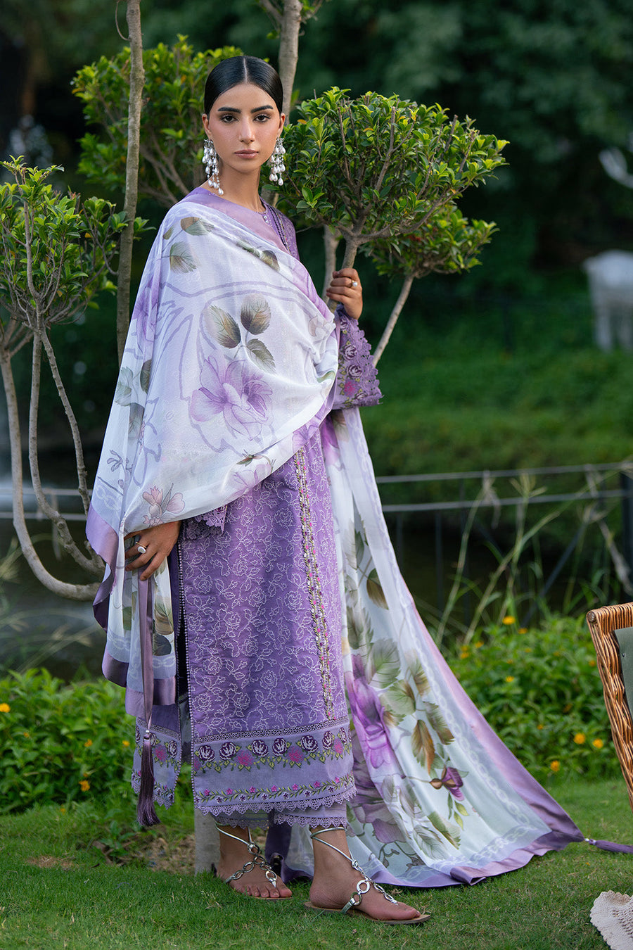 Model showing full outfit with purple embroidered lawn suit and cotton trousers