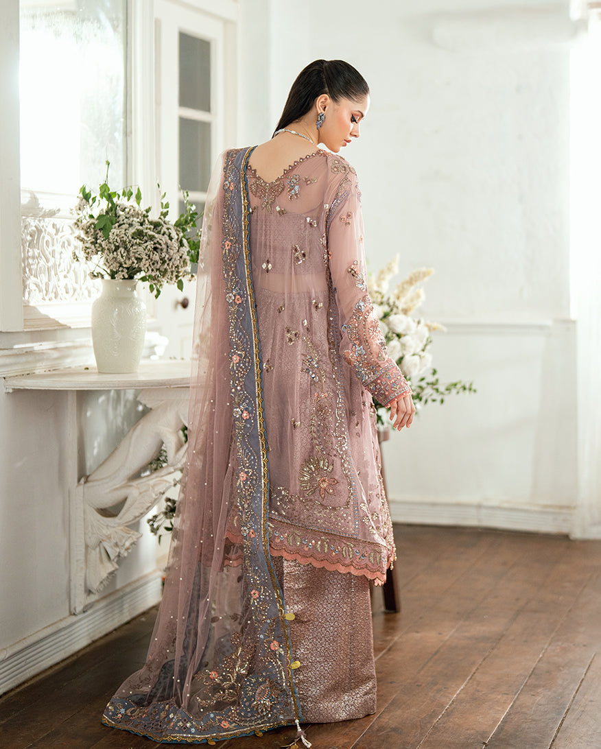 Back view of the chiffon suit highlighting the embroidered sheer dupatta with detailed floral borders and sequin work
