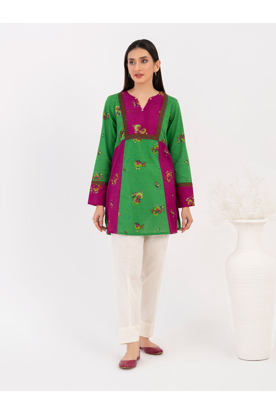 Full front view of model in printed khaddar kurti and white trousers