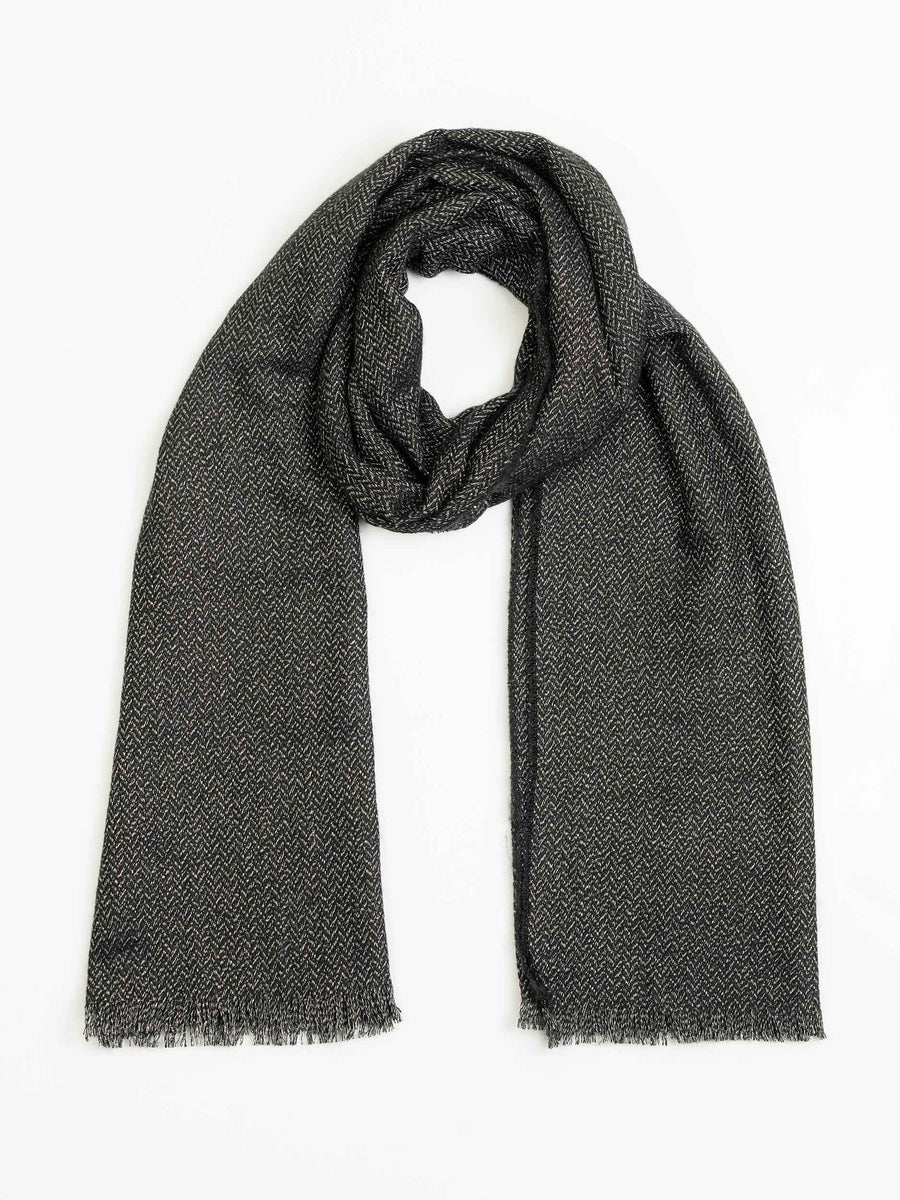Charcoal wool shawl laid flat showing full length and herringbone pattern with fringed edges