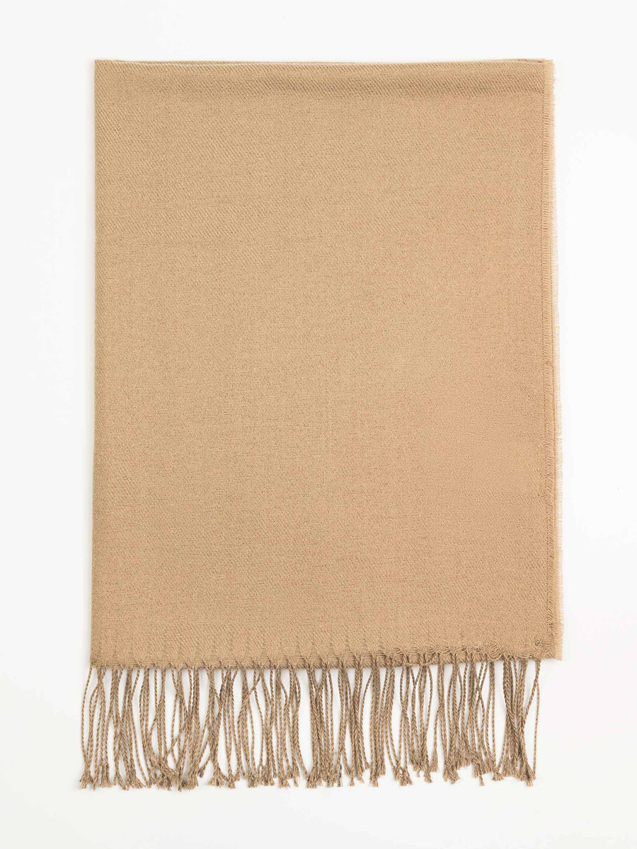 Close-up flat view of camel wool shawl highlighting fine weave and tassels