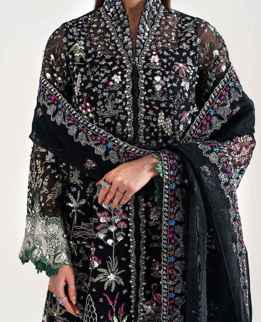 Detailed close-up of the embroidered front panel featuring intricate multi-colored floral and nature-inspired motifs
