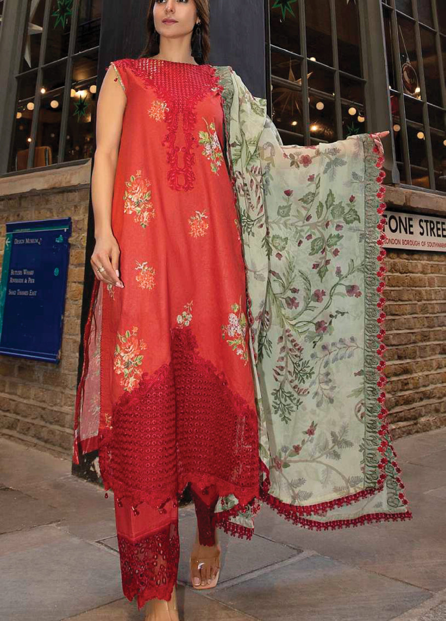 Side angle of a woman in an embroidered red lawn suit holding a light green floral chiffon dupatta with tassel embellishments.