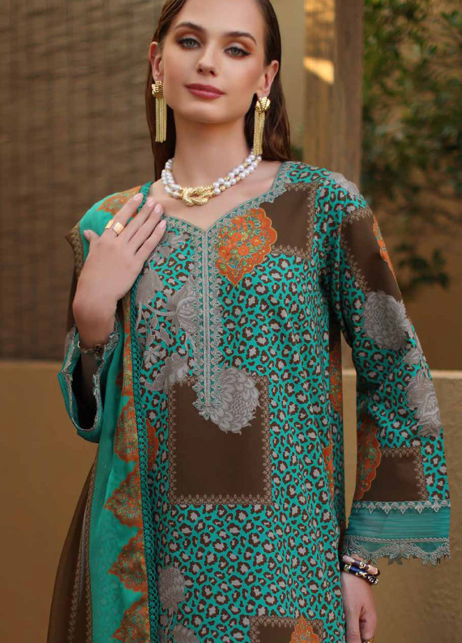 Close-up of woman wearing an embroidered lawn shirt highlighting intricate neckline embroidery and floral patchwork in teal, brown, and orange shades