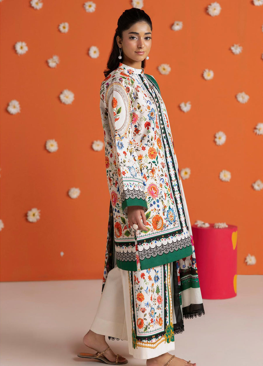 Side view of woman showcasing the detailed floral prints on the lawn shirt and trousers of the 3-piece suit with coordinating dupatta.