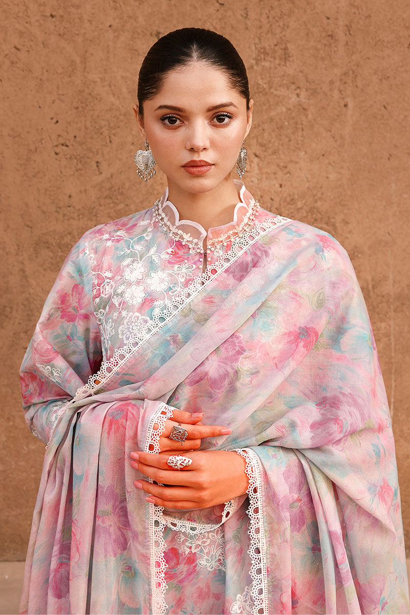 Close-up frontal view highlighting woman in pastel floral embroidered lawn suit holding embroidered dupatta