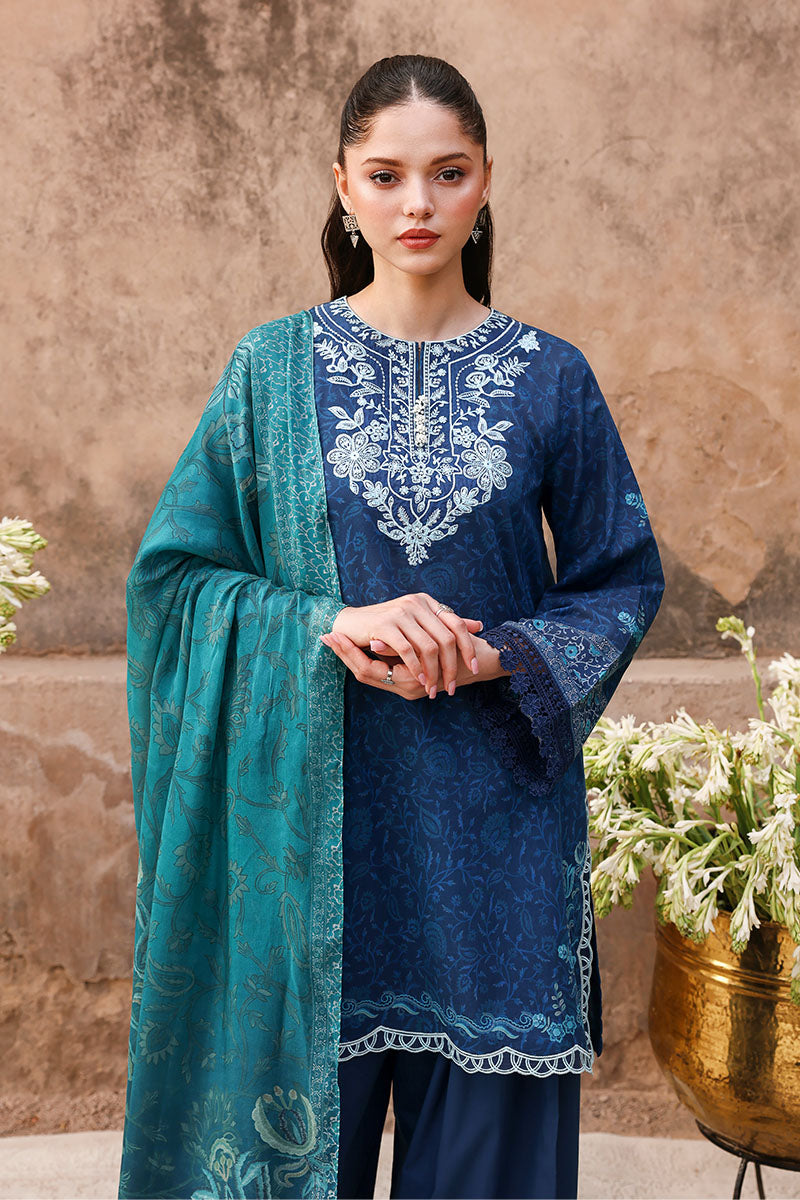 Close-up of embroidered floral neckline on navy blue lawn shirt with teal dupatta draped over the shoulder
