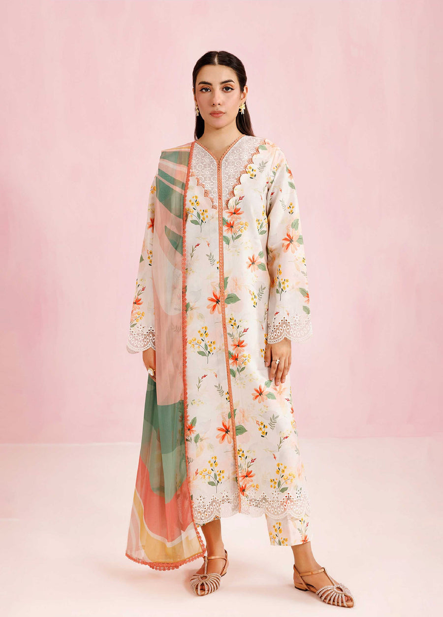 Front view of a woman wearing a floral embroidered cream lawn suit with scalloped lace sleeves and multicolor chiffon dupatta