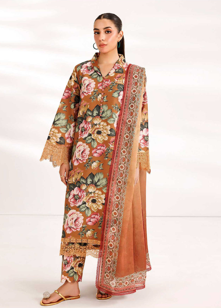 Woman wearing a brown floral printed embroidered lawn suit with organza lace sleeves and matching printed trousers