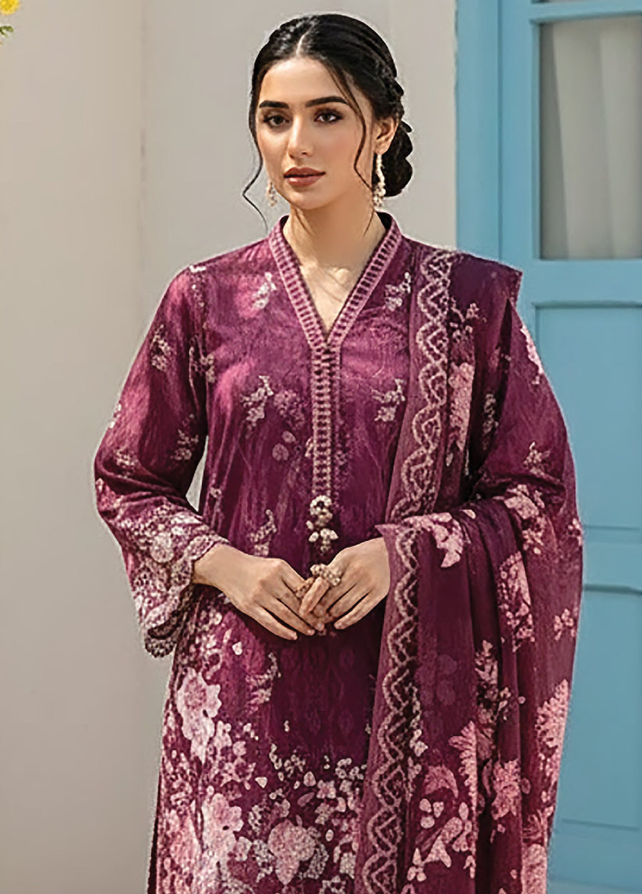 Close-up view of woman in deep plum floral printed lawn shirt with modest V-neck and intricate embroidery, holding matching dupatta
