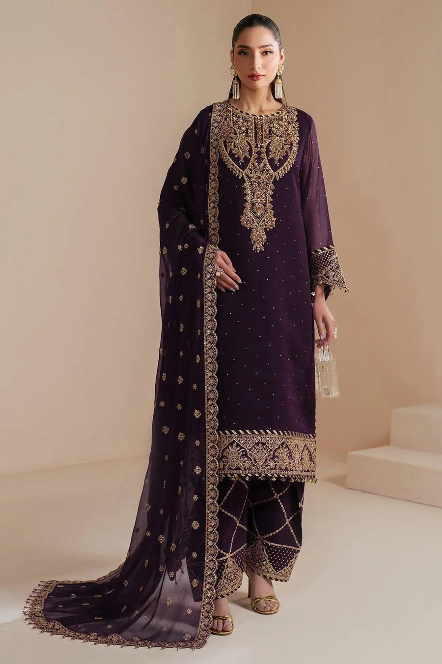 Full front view of embroidered chiffon three-piece suit with detailed embroidery on kameez hemline and trousers paired with sheer dupatta
