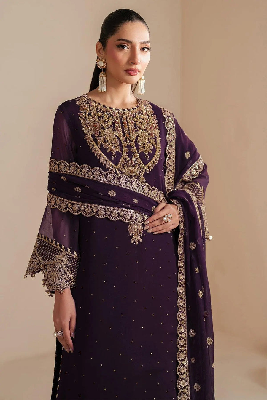 Detailed close-up of dupatta border embroidery and hand embellishments complementing the deep purple chiffon suit