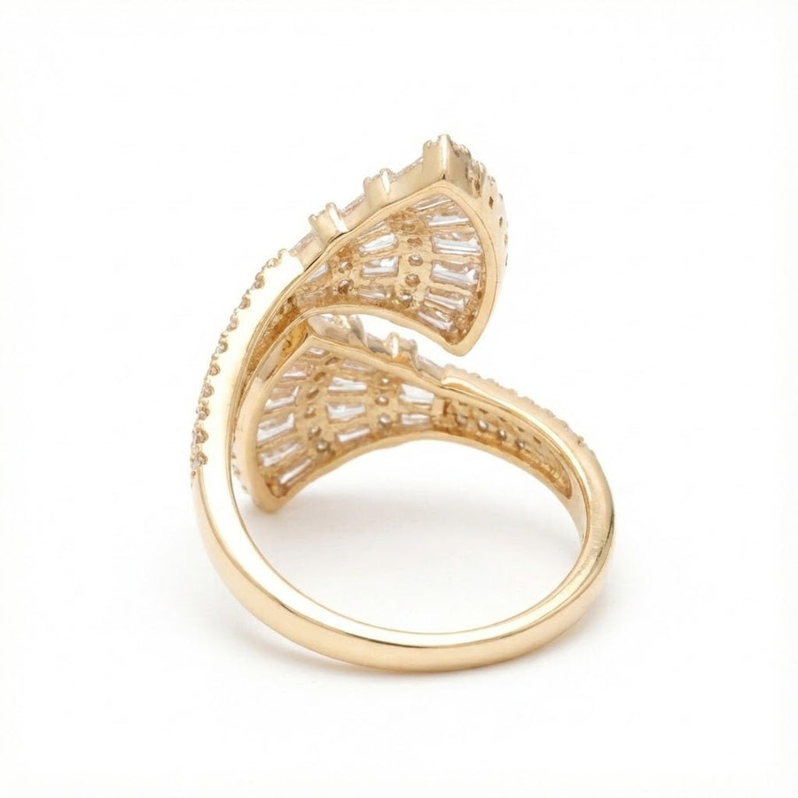 Side view of the gold fan-shaped ring showing detailed stone settings and smooth gold band