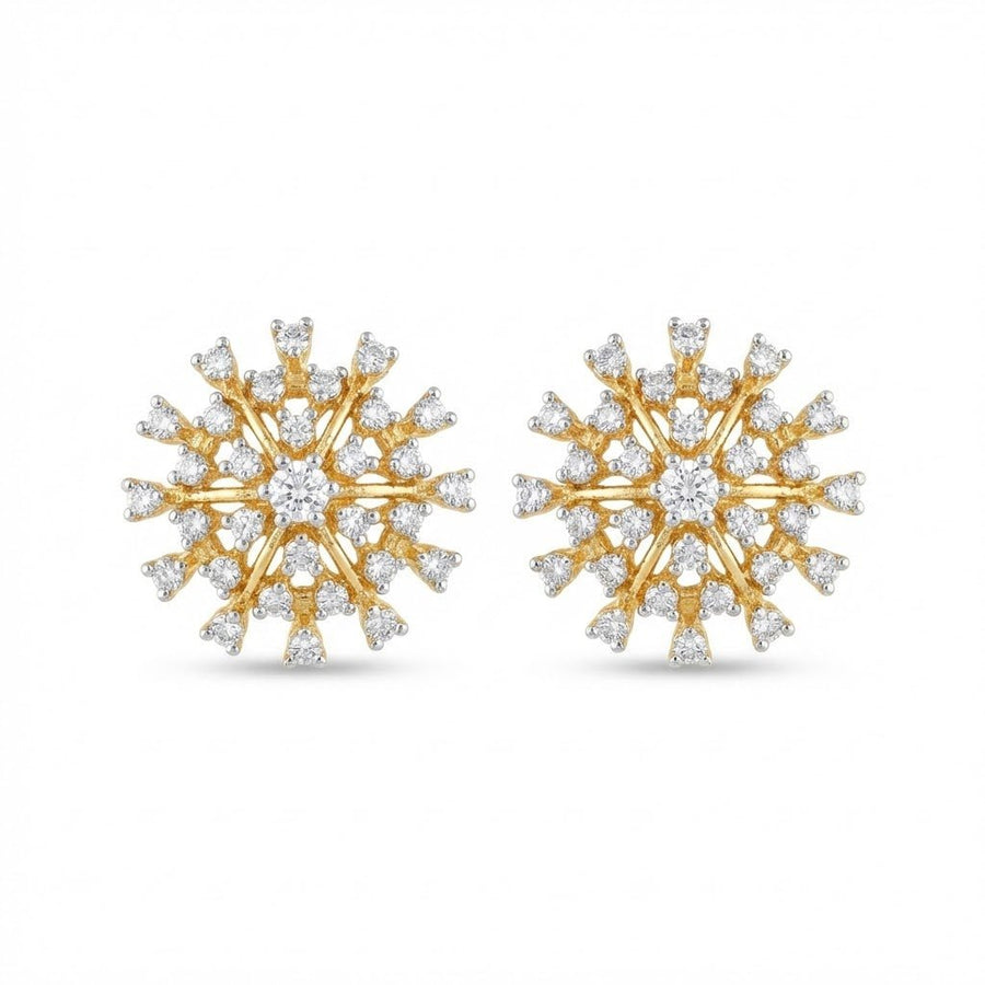 Close-up of gold starburst stud earrings adorned with sparkling clear crystals on white background