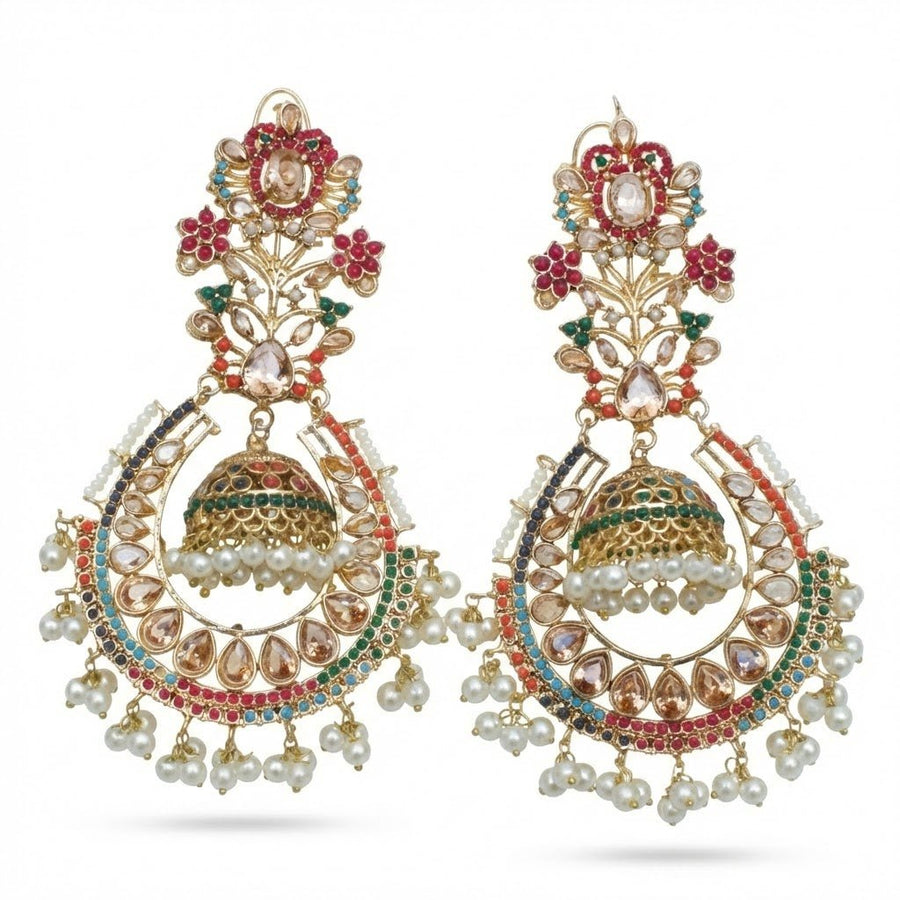 Elegant gold-tone jhumka earrings with clear and pink stones alongside pearl drops photographed against a white background