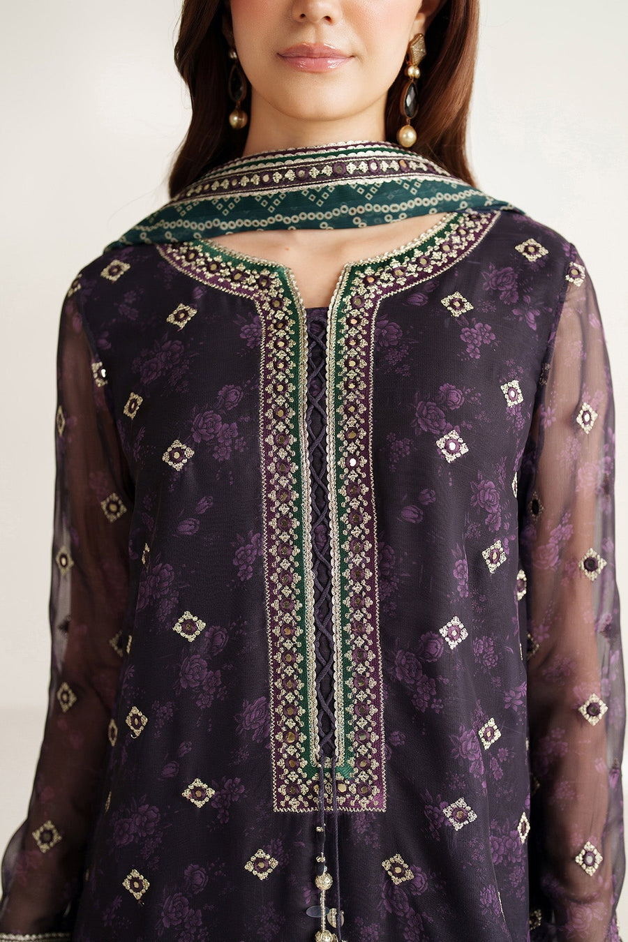 Back view of embroidered purple formal suit with green patterned dupatta