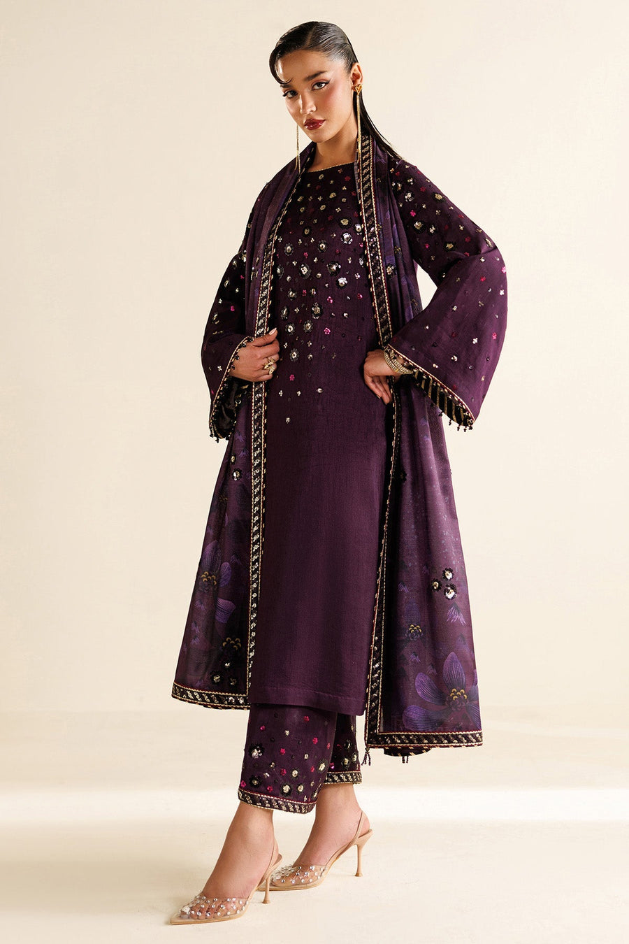 Detail view of translucent dupatta fabric with floral prints and embroidered borders