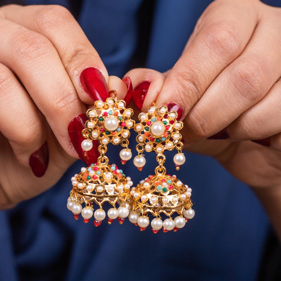 Detailed view of intricately designed Pearl Chandbali earrings showing floral patterns with pearls and colorful stones