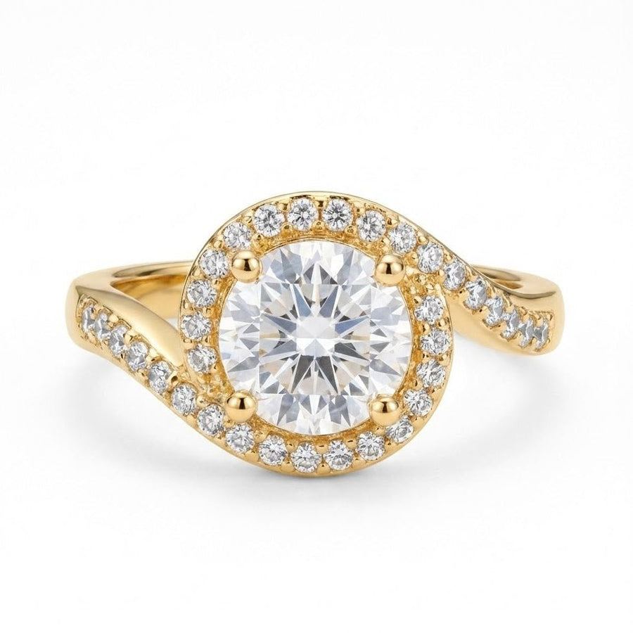 Close-up of gold halo diamond ring with round center stone and surrounding smaller diamonds on white background