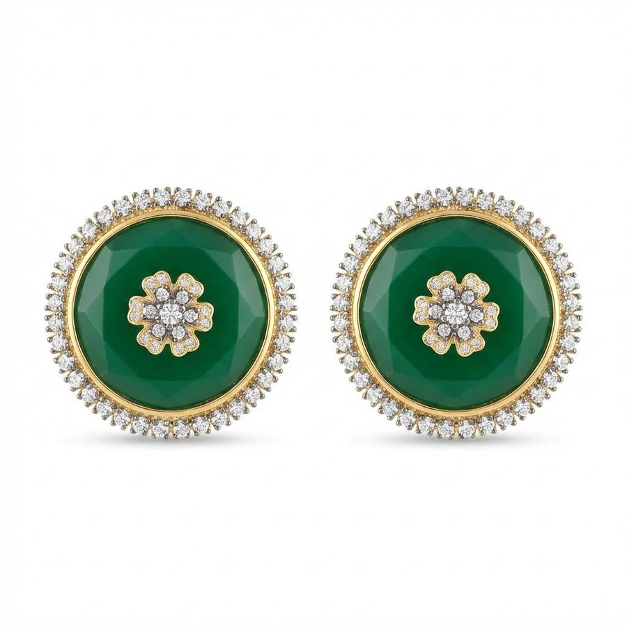 Clear faceted stone stud earrings with elaborate sparkling stone halo displayed on soft beige surface