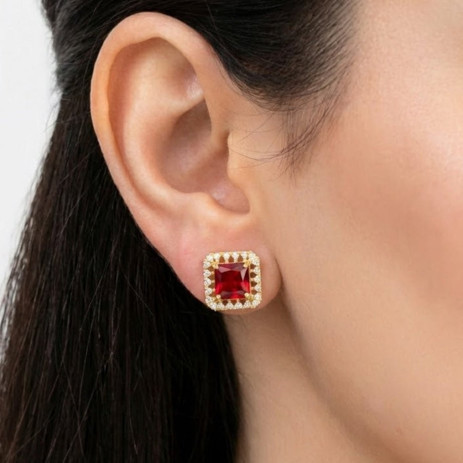 Female model wearing red square halo stud earring showcasing fit and size on earlobe