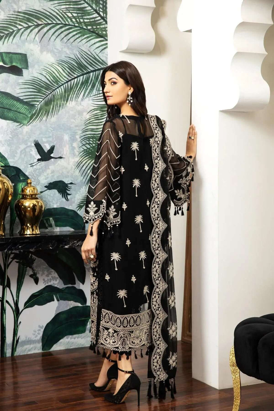 Full length front view highlighting full embroidery and tassel hem on black chiffon