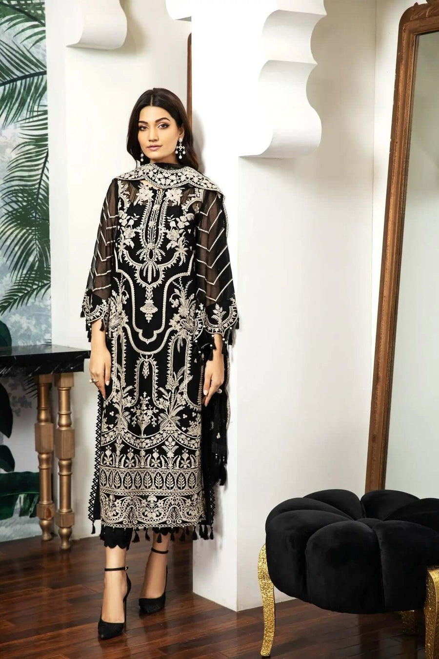 Back view of embroidered chiffon suit featuring palm tree motifs and scalloped borders
