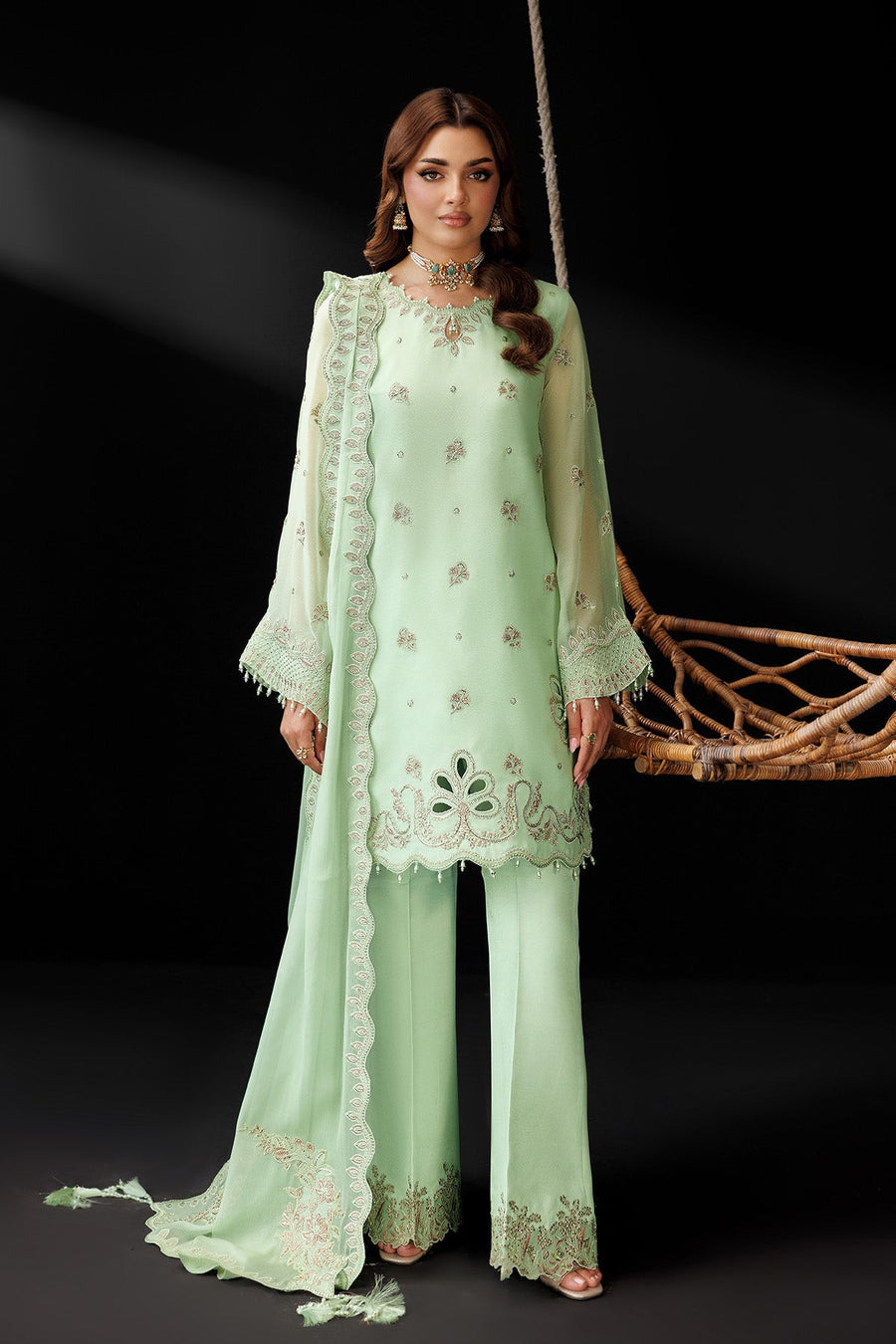 Front view of pastel green embroidered chiffon kurta with scalloped hem and embroidered trousers