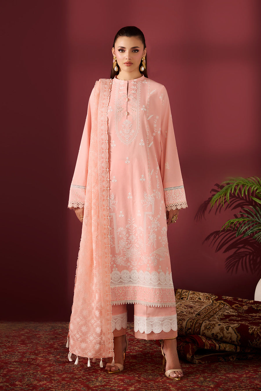 Front view of peach embroidered lawn shirt with cotton trousers and matching dupatta