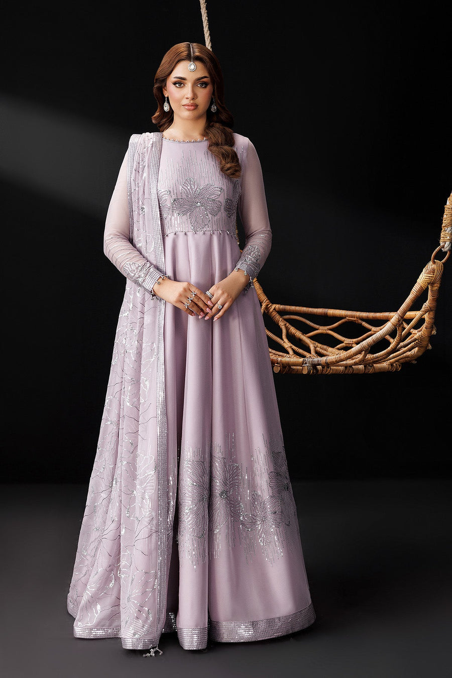 Portrait of woman wearing lavender maxi dress with elegant hairstyle