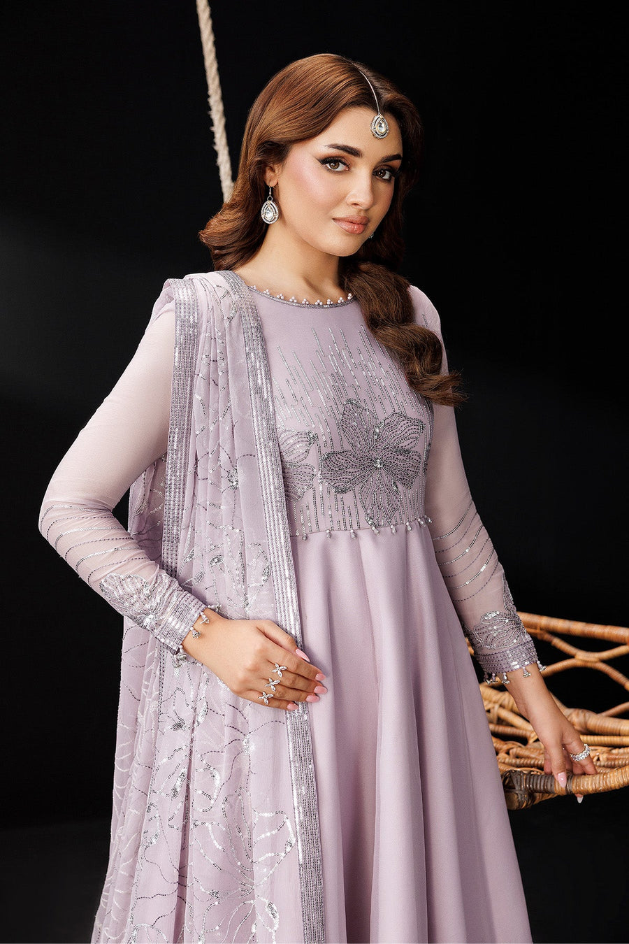 Close-up of bodice and sleeve embroidery on lavender maxi dress