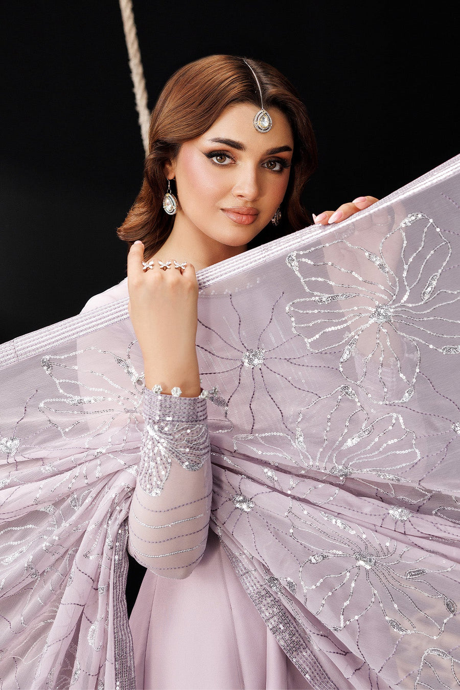 Side angle of model wearing lavender maxi dress with dupatta
