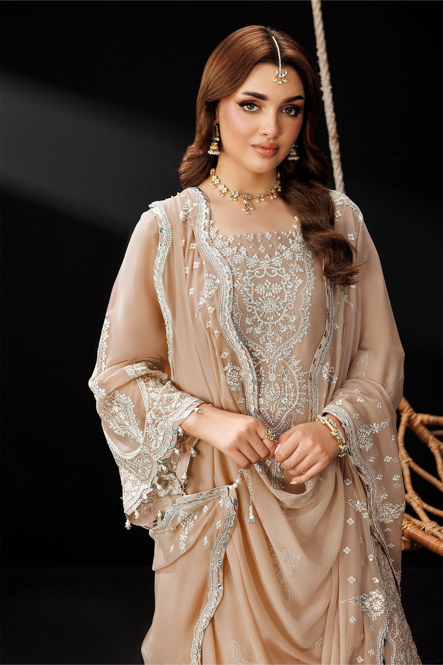 Close-up of model wearing the embroidered kameez showing neckline embroidery and dupatta drape